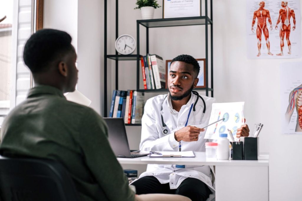 African man discussing male fertility concerns with a fertility specialist