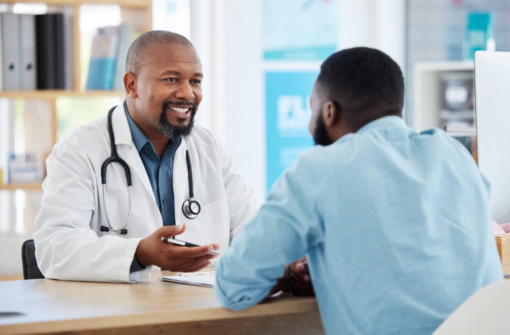 Doctor speaking with a patient during a general medical consultation